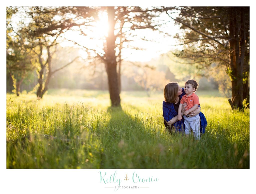 A mom kisses her boy | Kelly Cronin Photography | Cape Cod Family Photographer 