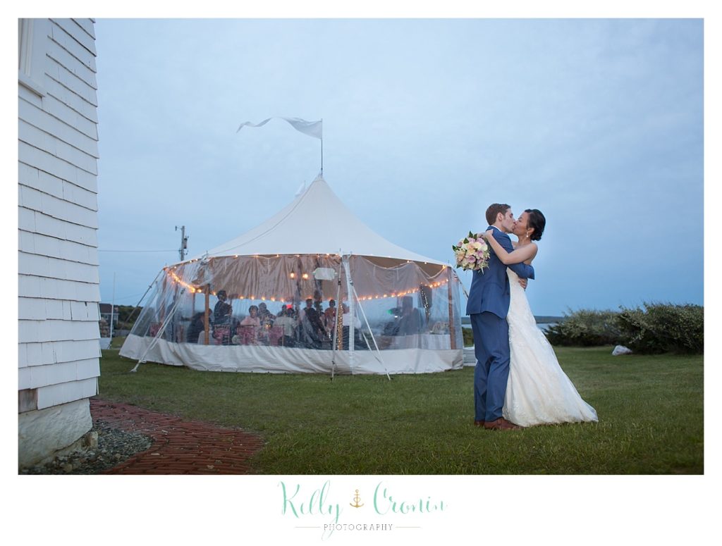 A couple kiss in front of a tent | Kelly Cronin | Wing's Neck Light 