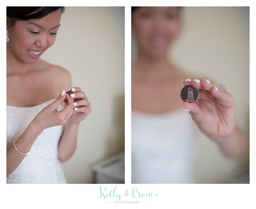 A bride holds a ring her groom saved for her for twenty years | Kelly Cronin | Wing's Neck Light 