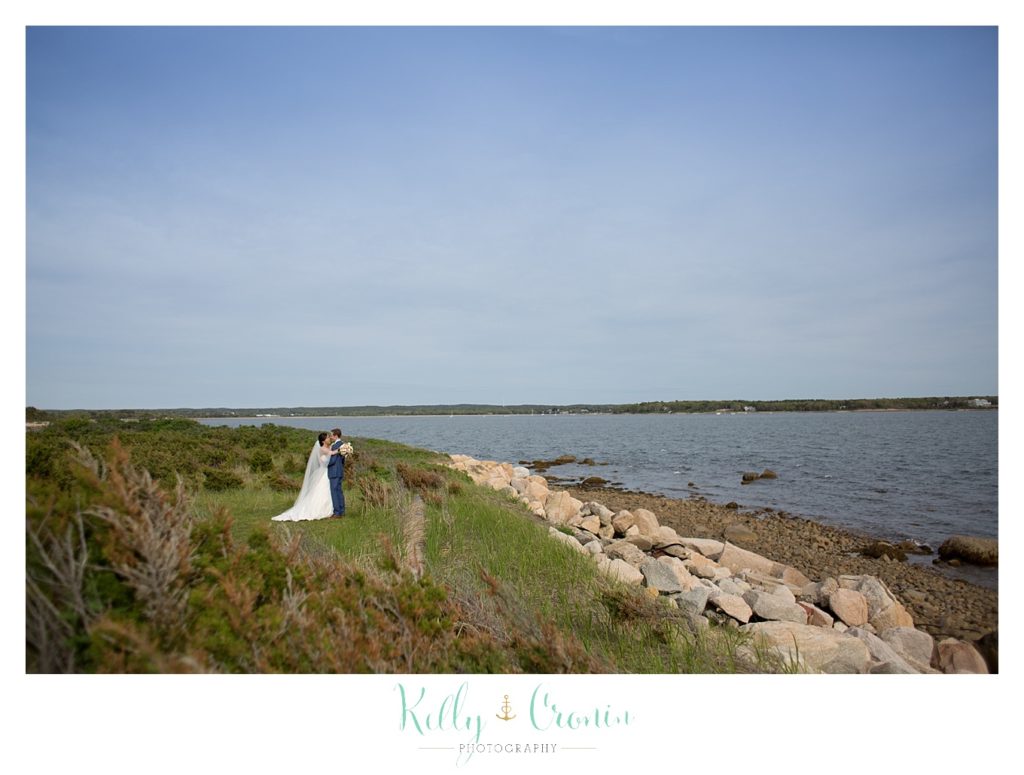A newlywed couple take a few moments alone together | Kelly Cronin | Wing's Neck Light 