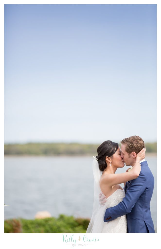 A bride kisses her groom | Kelly Cronin | Wing's Neck Light 