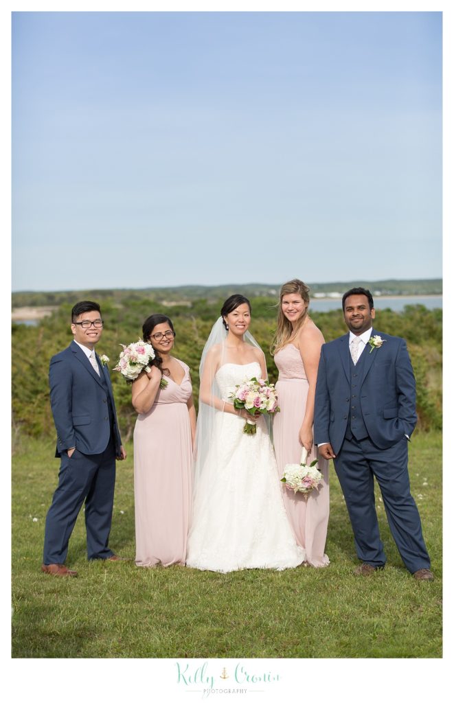 A bridal party poses | Kelly Cronin | Wing's Neck Light 