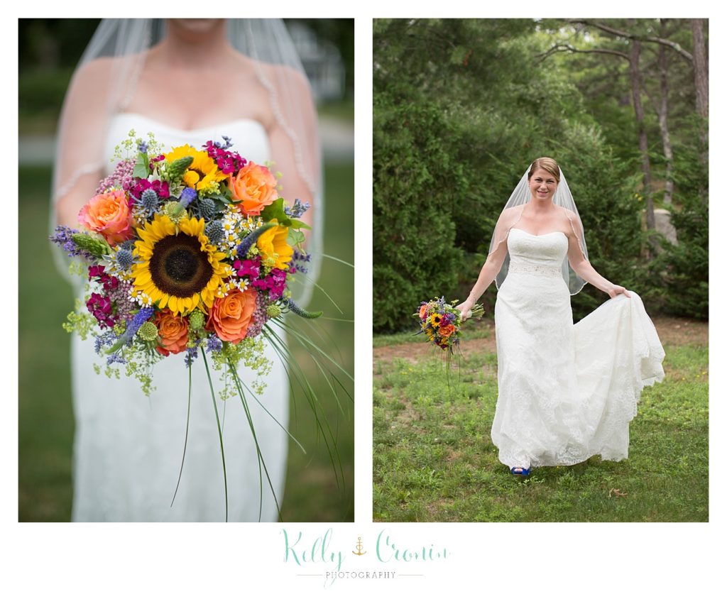 A bride holds her dress | Kelly Cronin Photography | Oyster River Landing