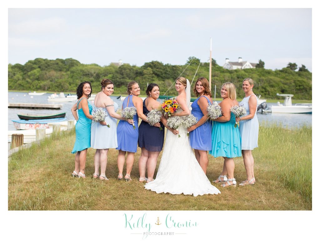 A bridal party pose together  | Kelly Cronin Photography | Oyster River Landing