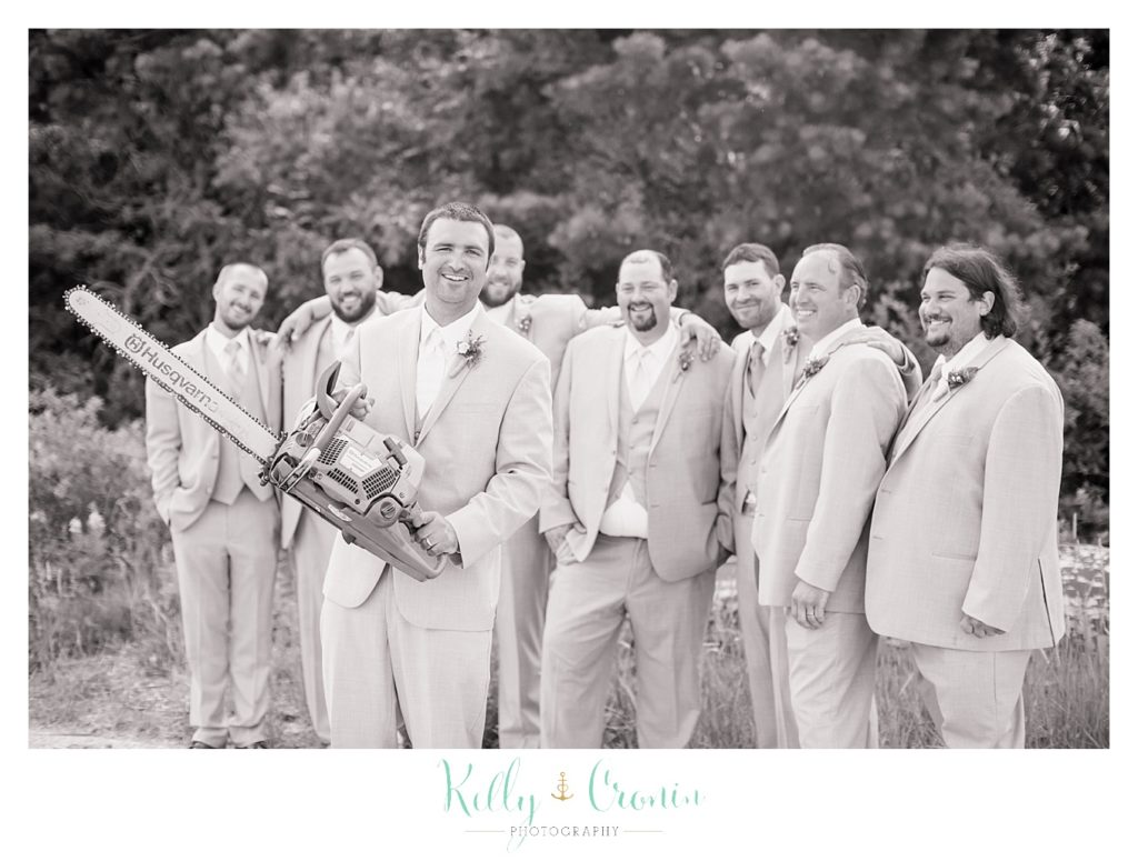 A groom celebrates his wedding  | Kelly Cronin Photography | Oyster River Landing