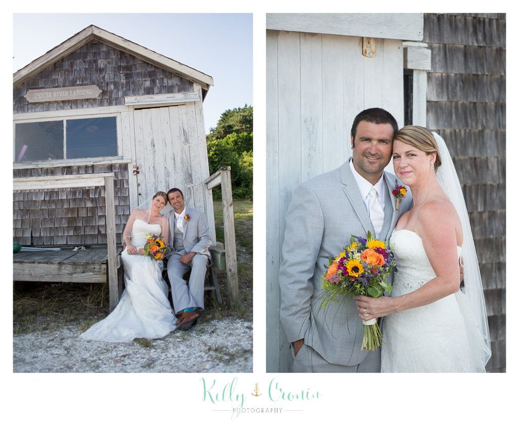A couple dig their toes into the sand  | Kelly Cronin Photography | Oyster River Landing
