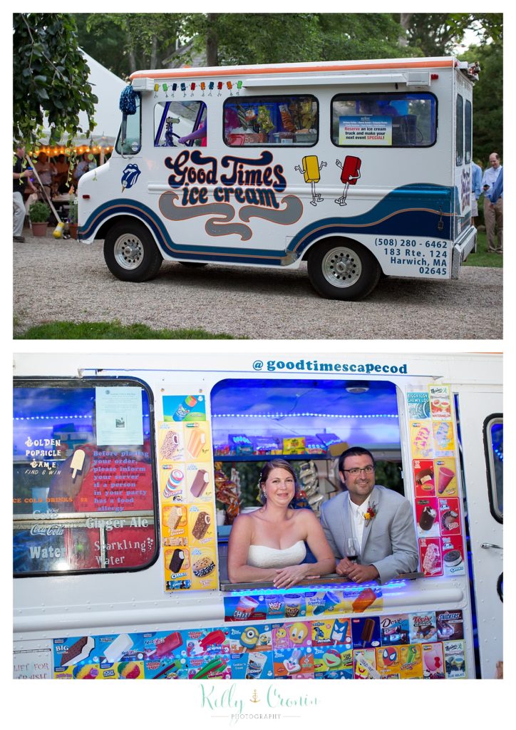 A bride and groom sit inside of a food truck  | Kelly Cronin Photography | Oyster River Landing