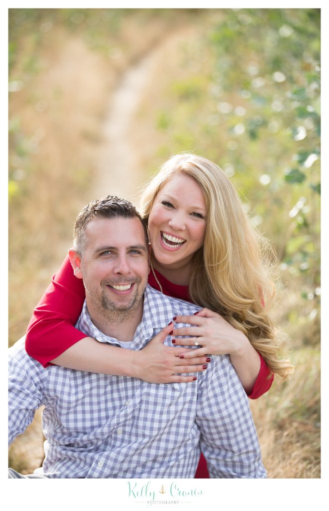 A woman laughs with love in her heart  | Kelly Cronin Photography | Outdoor Engagement Session