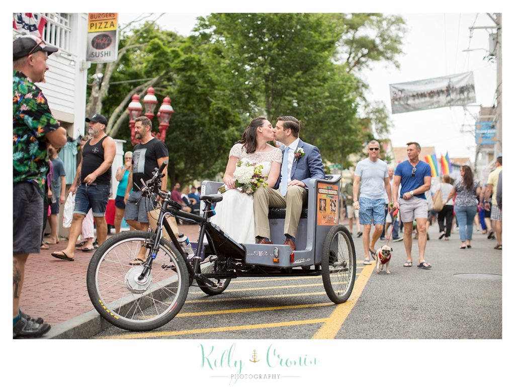 A couple kiss on a bike | Kelly Cronin Photography | Pilgrim Monument
