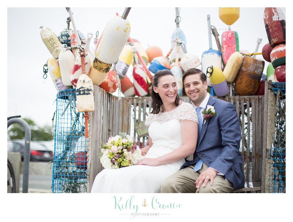 A bride looks at her groom | Kelly Cronin Photography | Pilgrim Monument