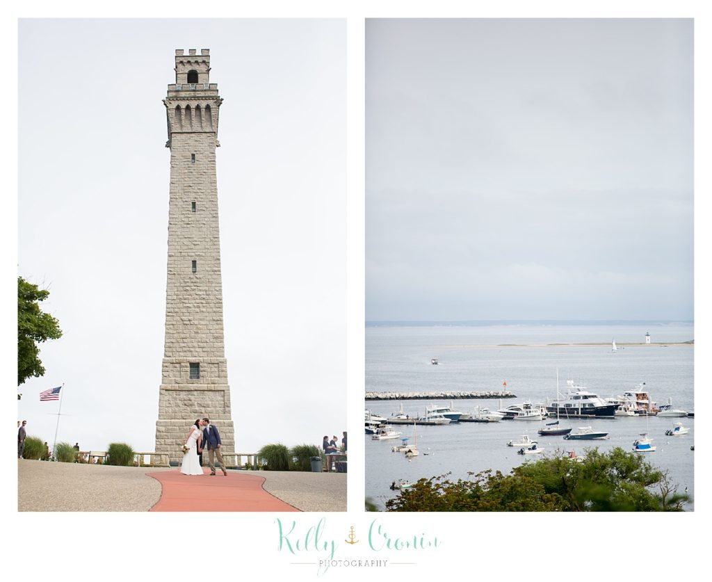 A bride and groom pose in front of a monument | Kelly Cronin Photography | Pilgrim Monument