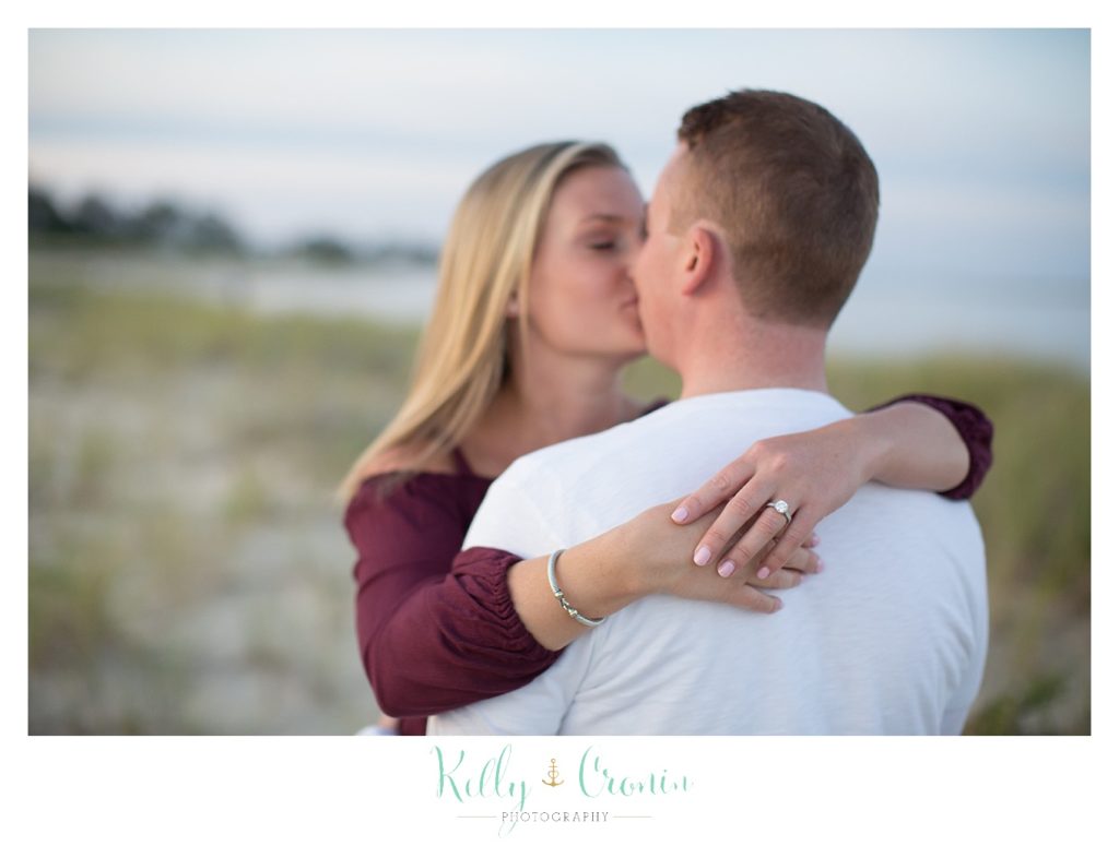 A woman kisses her love | Kelly Cronin Photography | Cape Cod Engagement Photographer