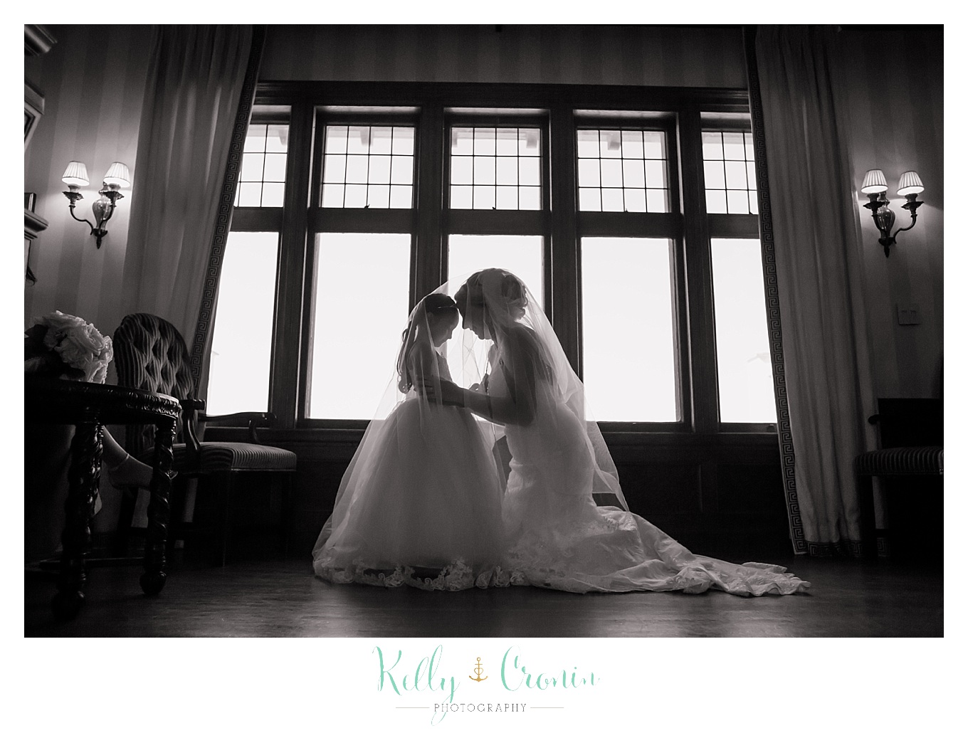 A bride kneels to her flower girl | Kelly Cronin Photography | Resort Wedding in Cape Cod