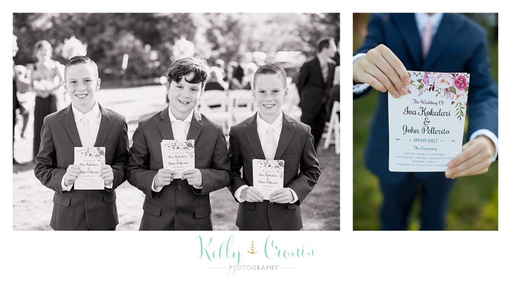 Ring bearers hold up invitations | Kelly Cronin Photography | Resort Wedding in Cape Cod