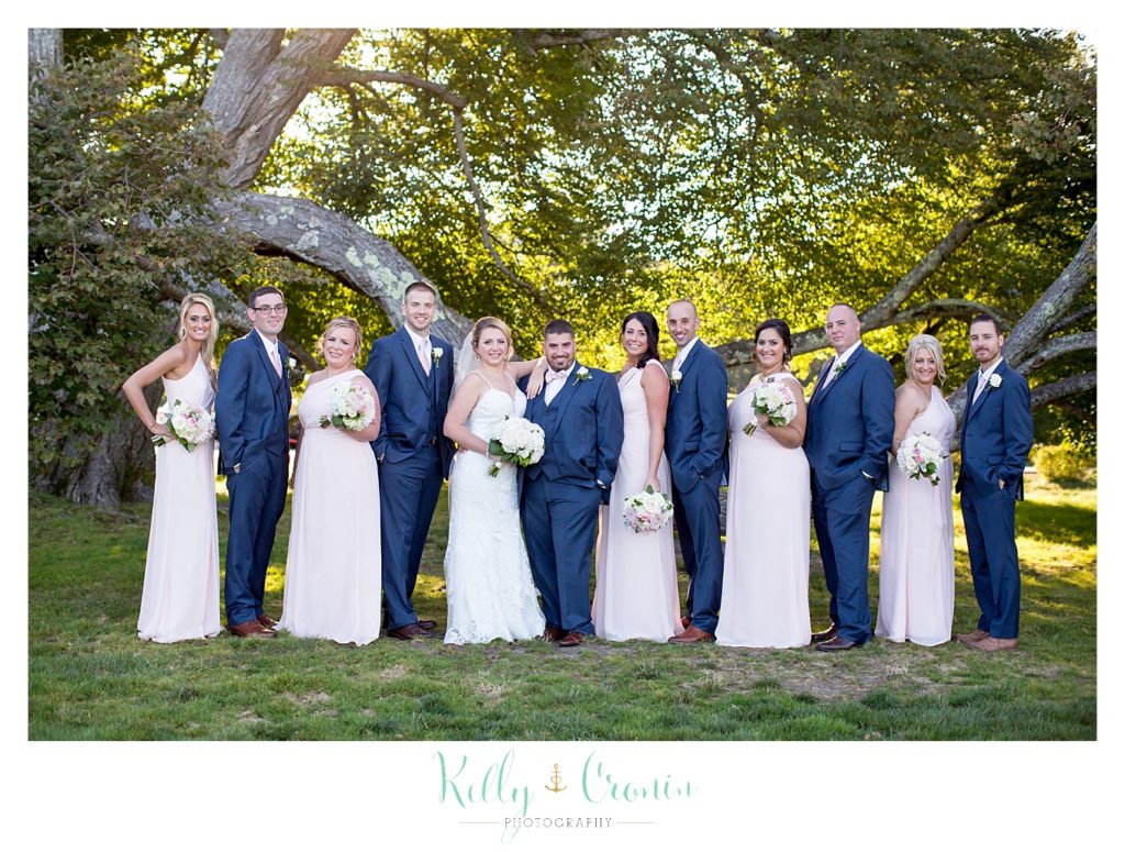 A wedding party poses | Kelly Cronin Photography | Resort Wedding in Cape Cod