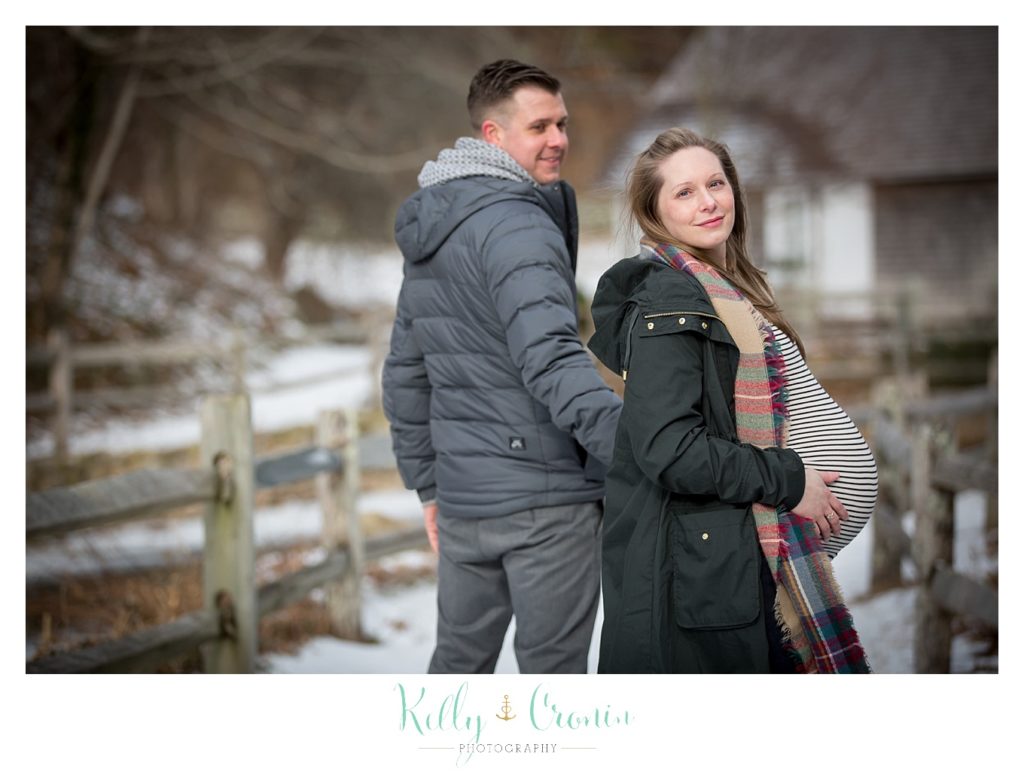 A woman's pregnant belly hangs out  | Kelly Cronin Photography | Cape Cod Maternity Photographer