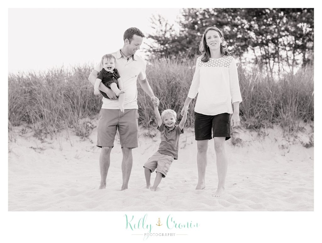 Parents swing their child  | Kelly Cronin Photography | Seaside Photography