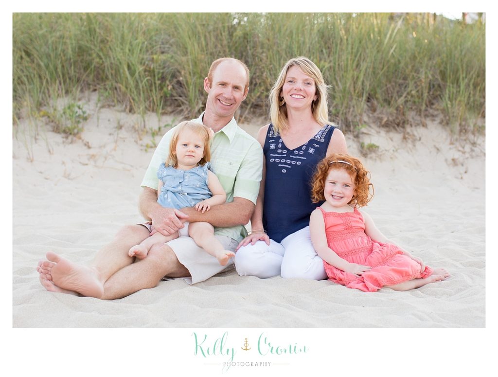 A family sits together  | Kelly Cronin Photography | Seaside Photography