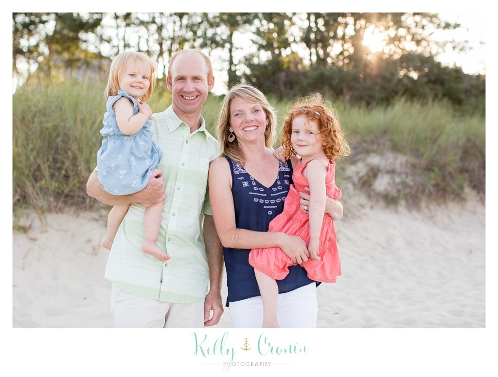 A family poses together  | Kelly Cronin Photography | Seaside Photography