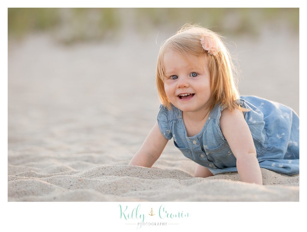 A little girl crawls in the sand  | Kelly Cronin Photography | Seaside Photography