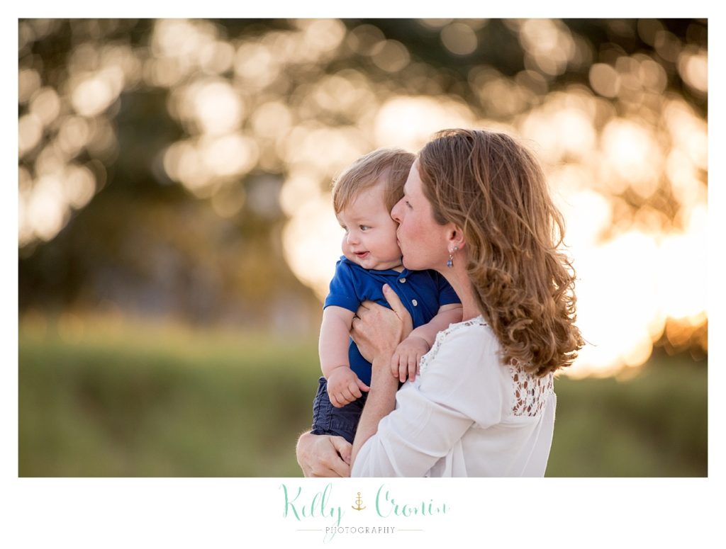 A mother kisses her baby  | Kelly Cronin Photography | Seaside Photography