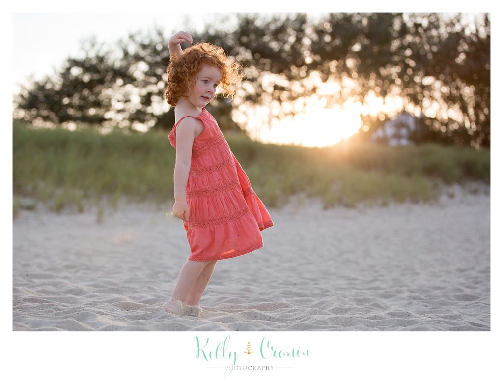 A girl twirls her dress  | Kelly Cronin Photography | Seaside Photography