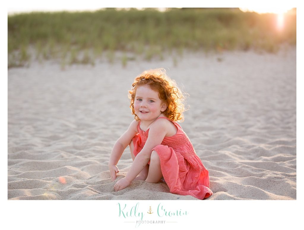 A girl digs her toes in the sand  | Kelly Cronin Photography | Seaside Photography