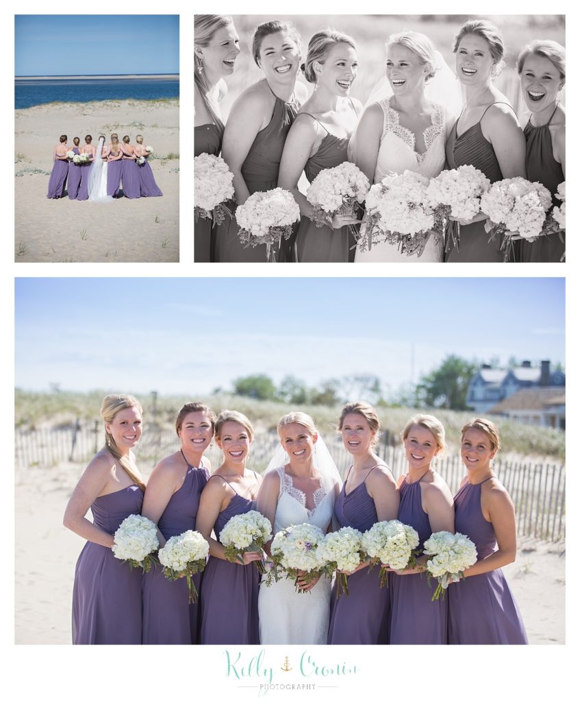 A bridal party shows off their flowers.