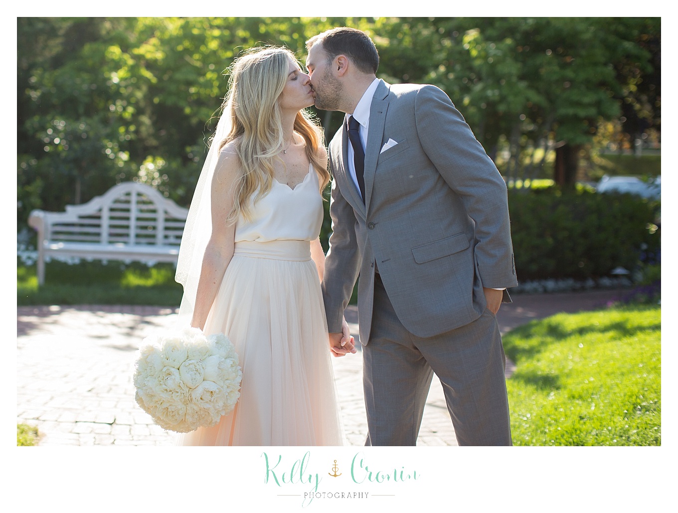 A man kisses his new wife | Kelly Cronin Photography | Wequassett Resort And Gold Club