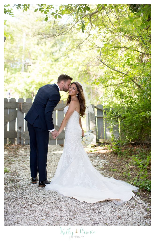 A man kisses his new wife | Kelly Cronin Photography | Cape Cod love story