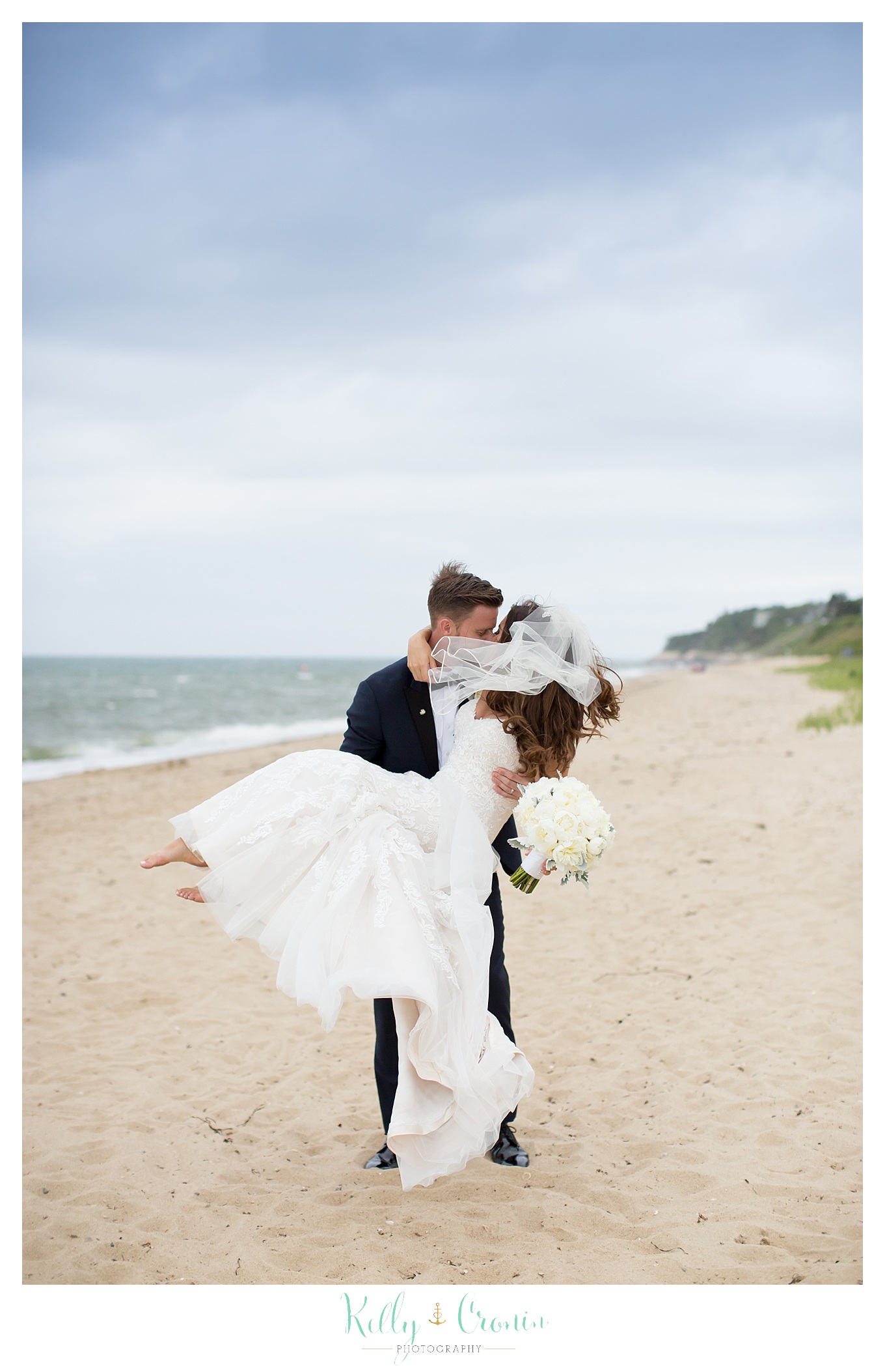 A man carries his new wife | Kelly Cronin Photography | Cape Cod love story