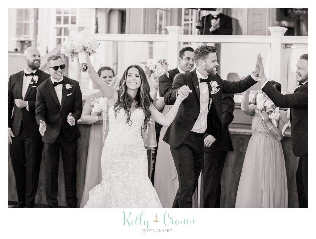 A couple cheers for their wedding day | Kelly Cronin Photography | Cape Cod love story