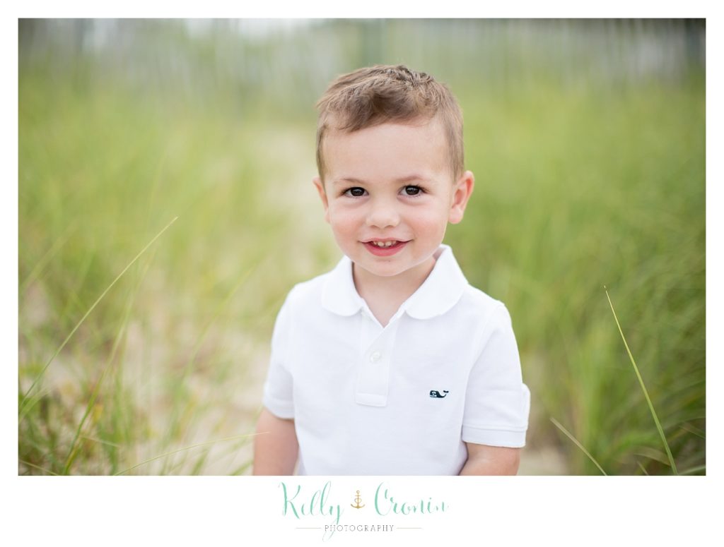 A boy gives a smile | Kelly Cronin Photography | Seaside Session in Cape Cod