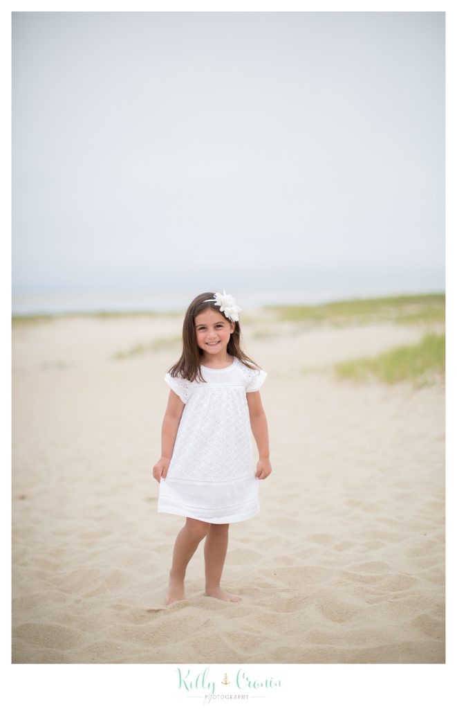 A girl walks along the beach  | Kelly Cronin Photography | Seaside Session in Cape Cod