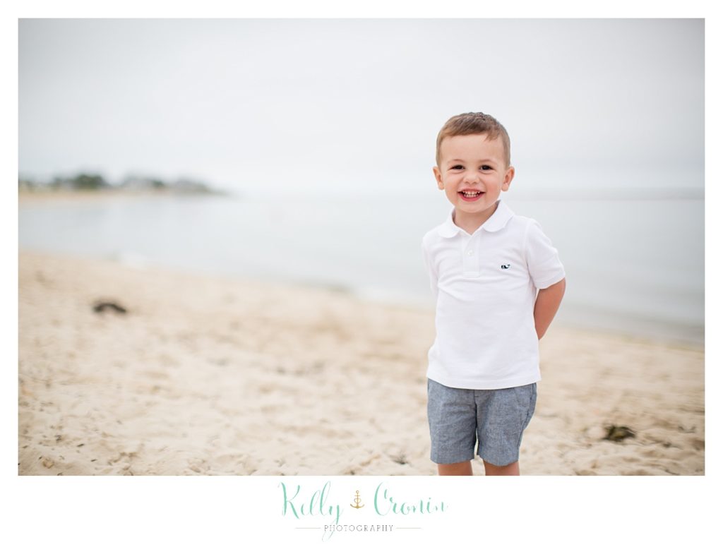 A boy gives a big smile  | Kelly Cronin Photography | Seaside Session in Cape Cod