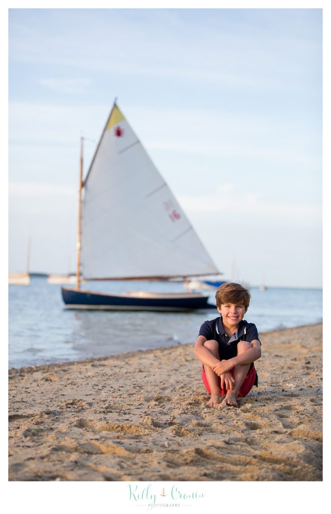 A boy smiles at his Cape Cod Family Photographer
