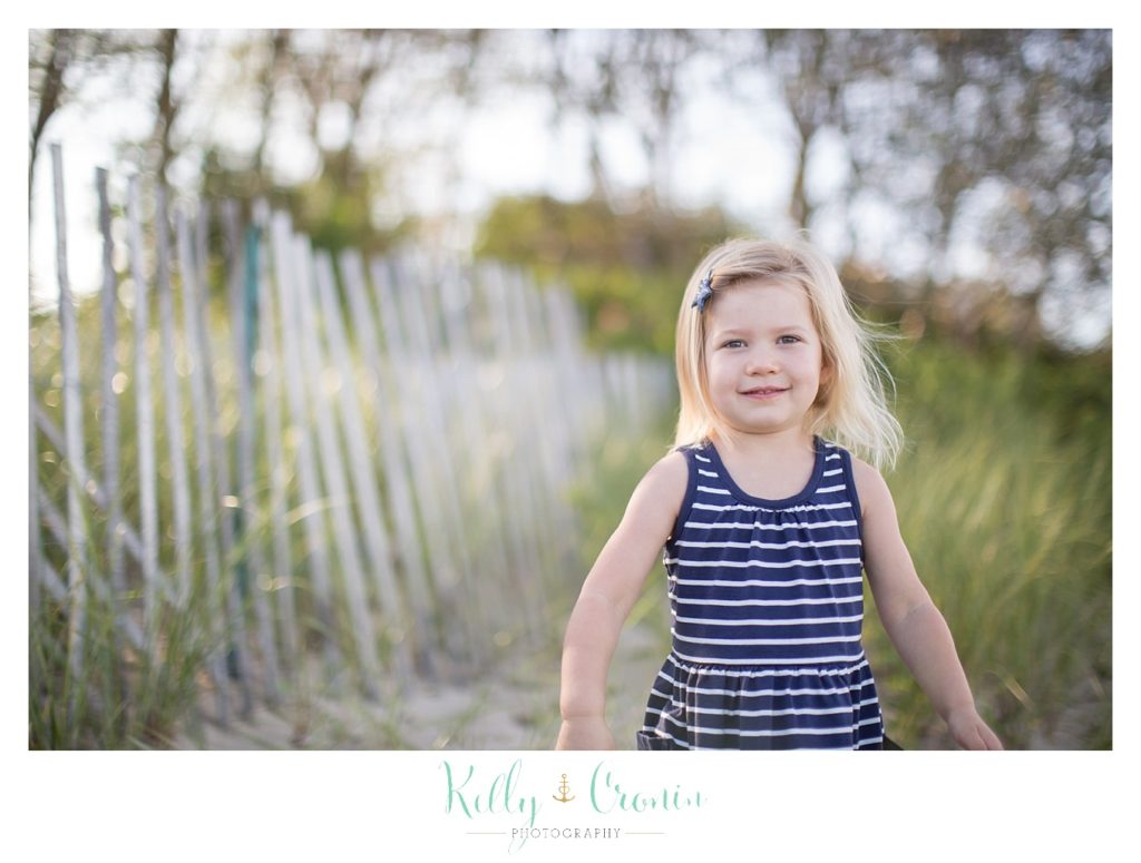 A little girl walks in the sand | Kelly Cronin Photography | Family Photography in Cape Cod