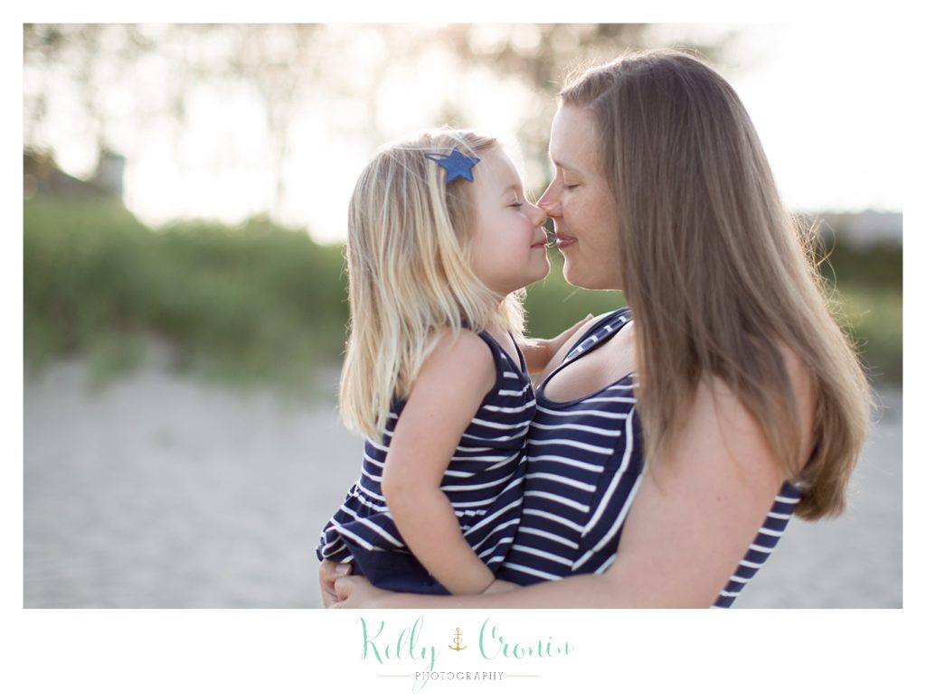A little girl kisses her mama | Kelly Cronin Photography | Family Photography in Cape Cod
