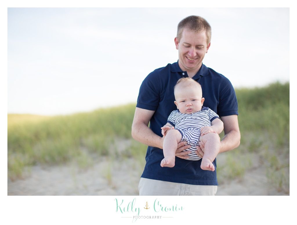 A dad holds his baby | Kelly Cronin Photography | Family Photography in Cape Cod