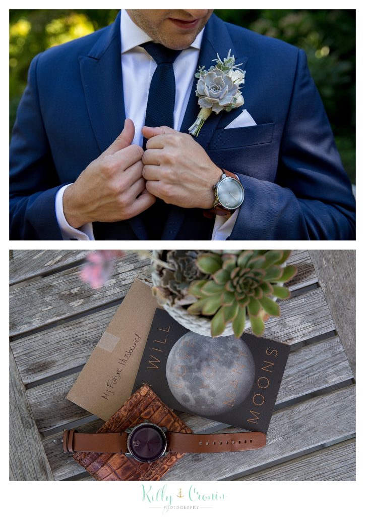 A man adjusts his suit. 