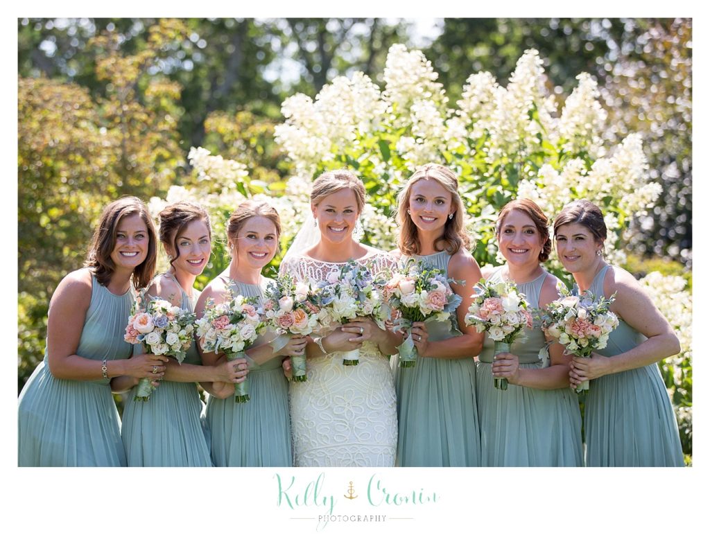 A bridal party pose for a photo at the Wequassett Resort and Golf Club. 