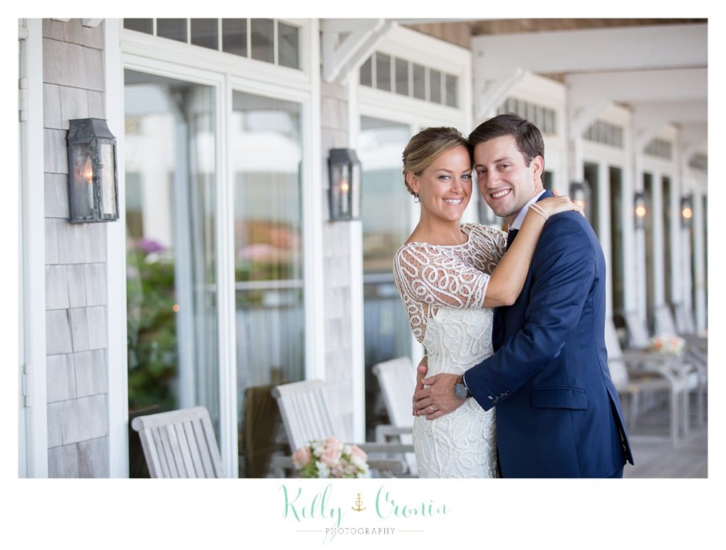 A woman hugs her new husband. 