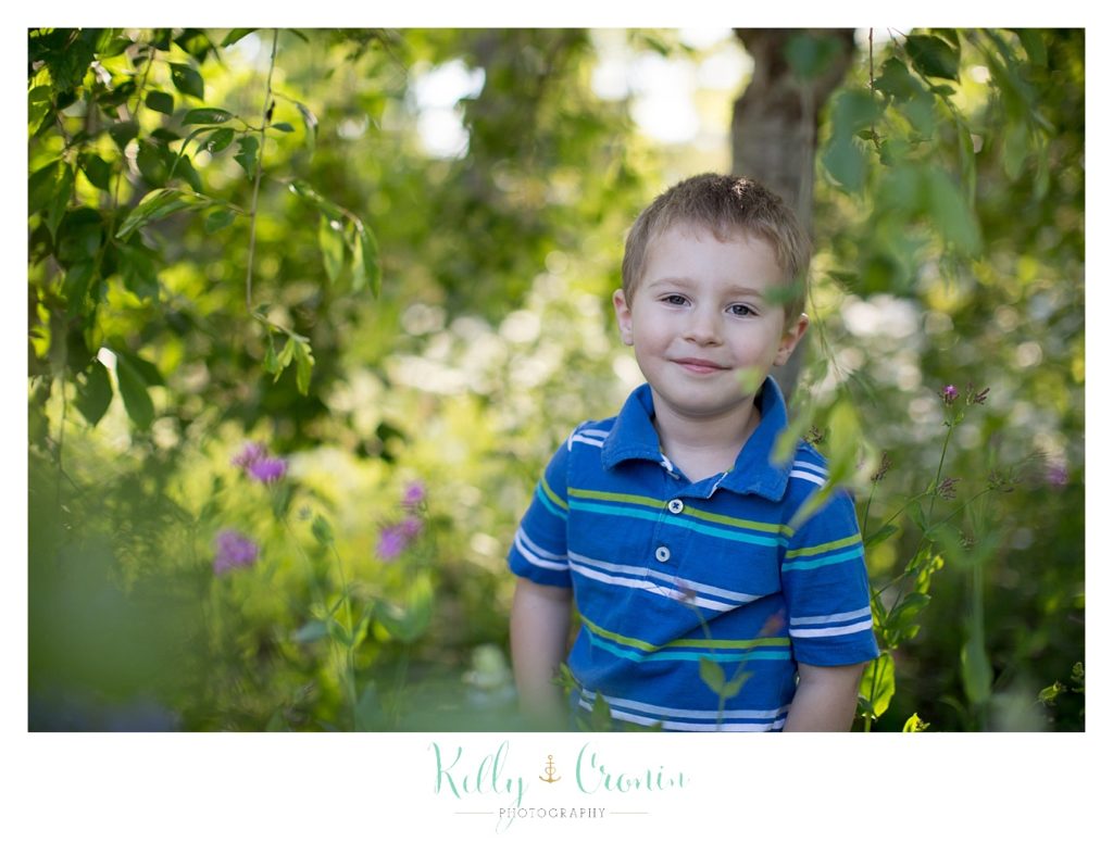 A boy smiles for a photo during some family mini sessions. 