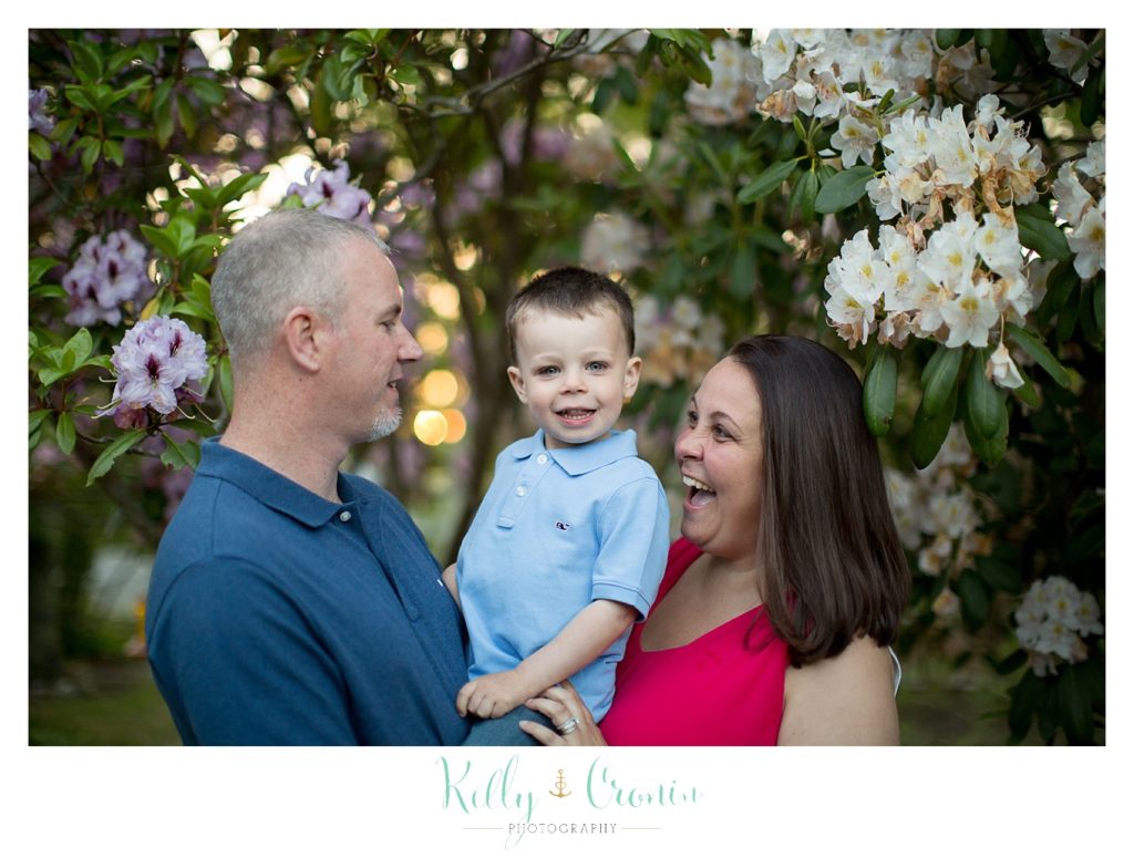 A mother laughs with her child | Family Photographer In Cape Cod 