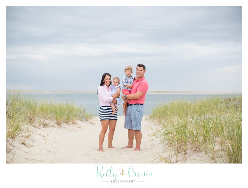A family stands together for their family photographs in Cape Cod. 