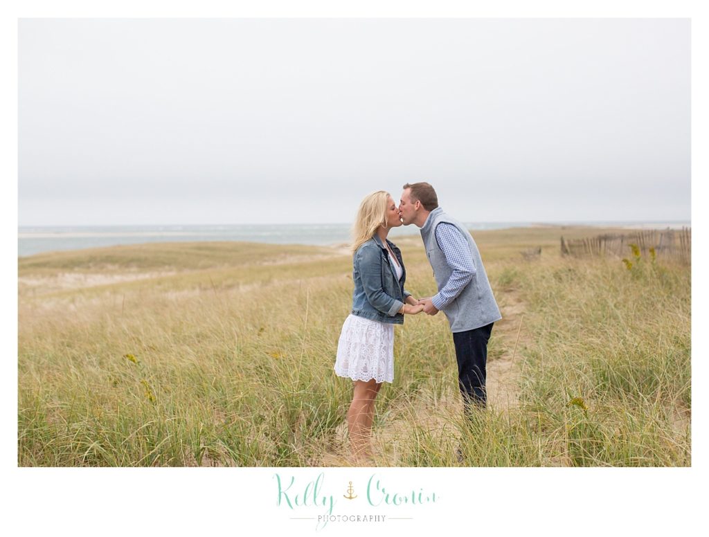 A man kisses his fiance | Cape Cod Engagement Photographer 