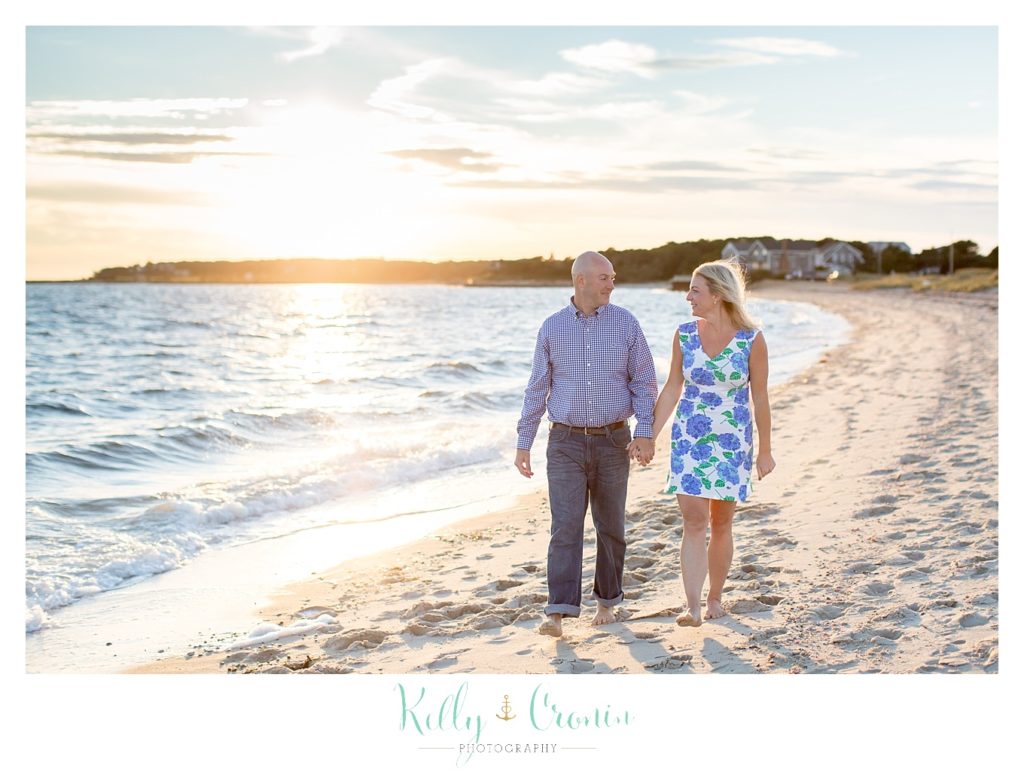 A couple walk along the shore | Engagement Session In Cape Cod