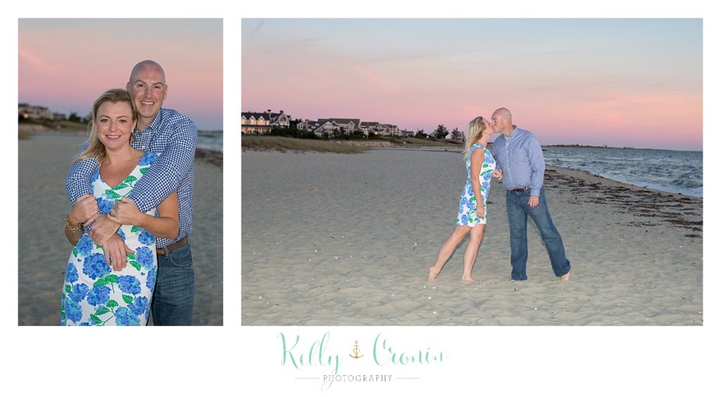 A couple kiss in front of a pink sky | Engagement Session In Cape Cod