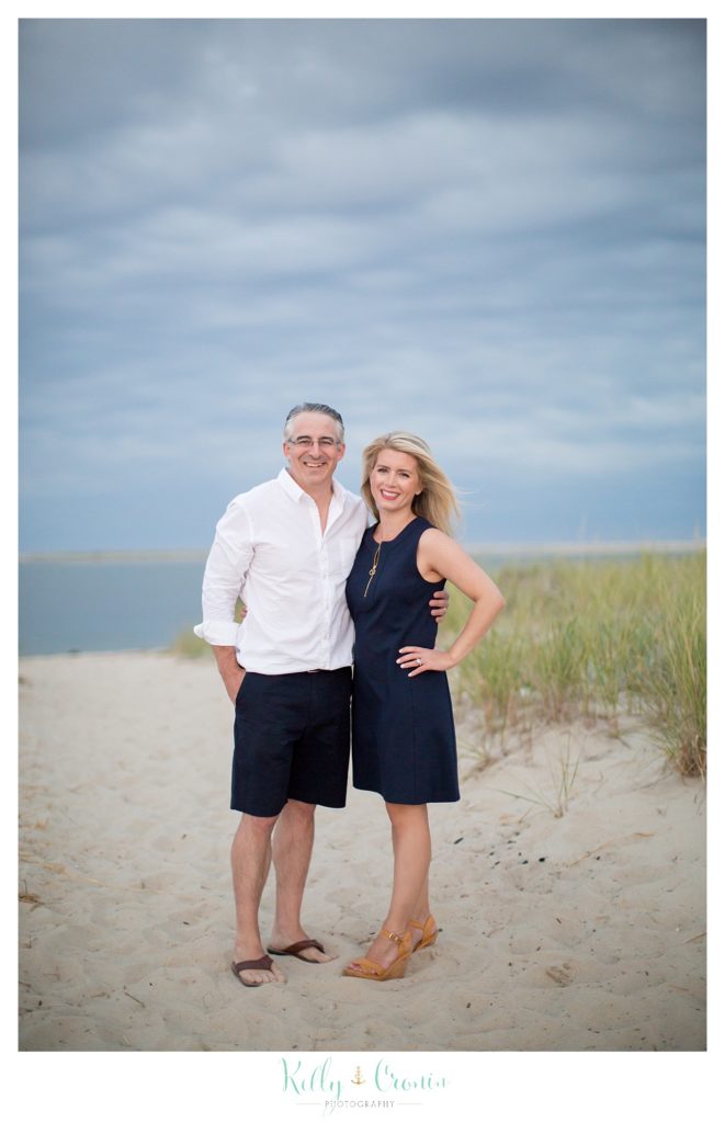 A couple pose for a photo during their family portraits in Cape Cod. 