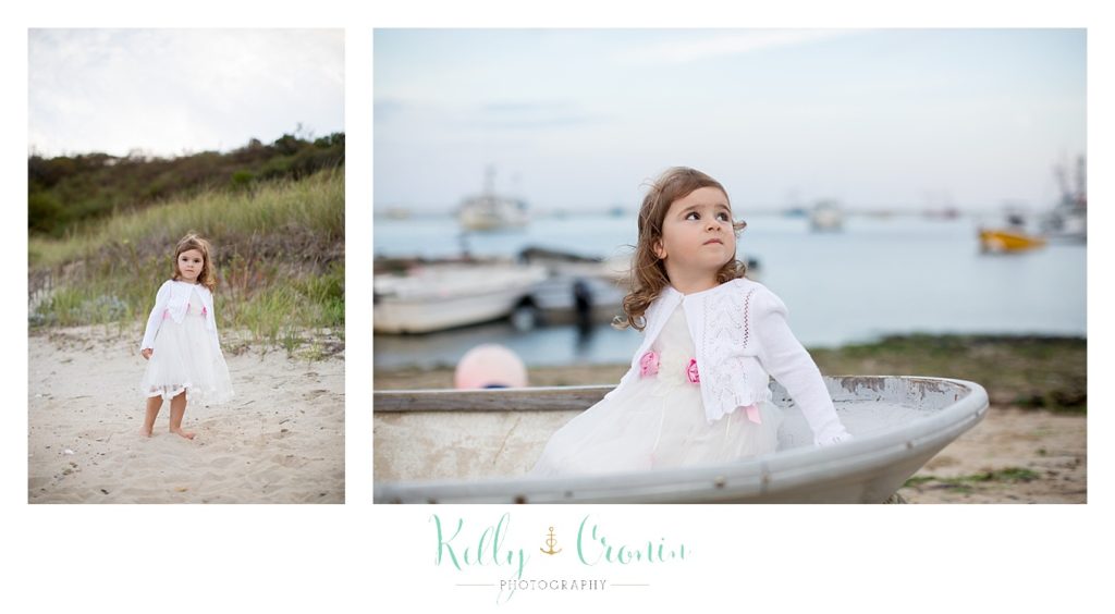 A girl walks in the sand during her Mini Family Photo Session. 